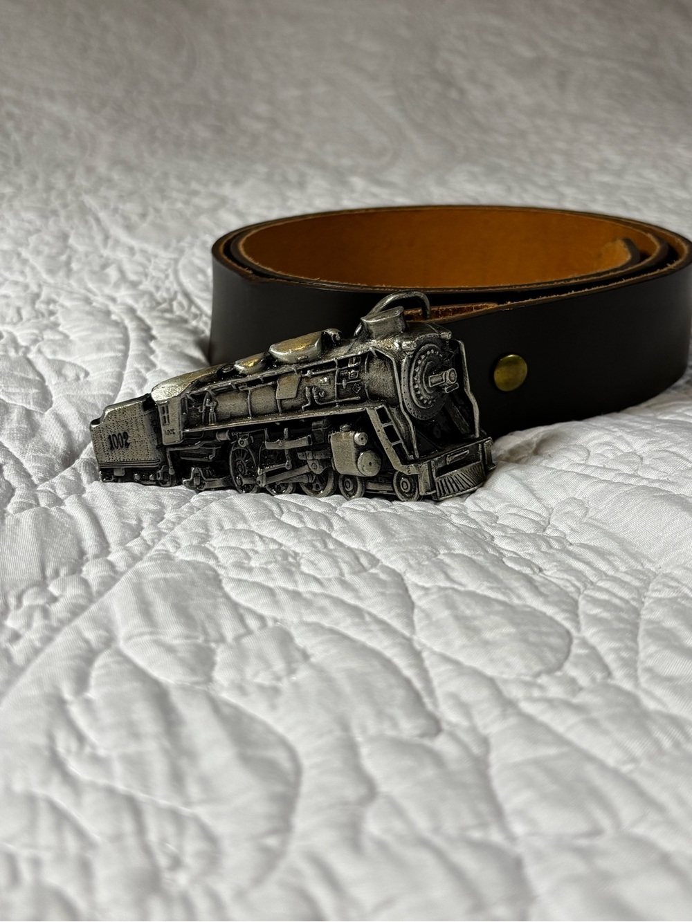 Ubique Train Buckle with Brown Leather Belt.